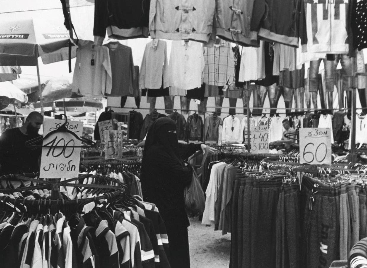 A Muslim woman shopping in Ramla. Photo by Paul Margolis