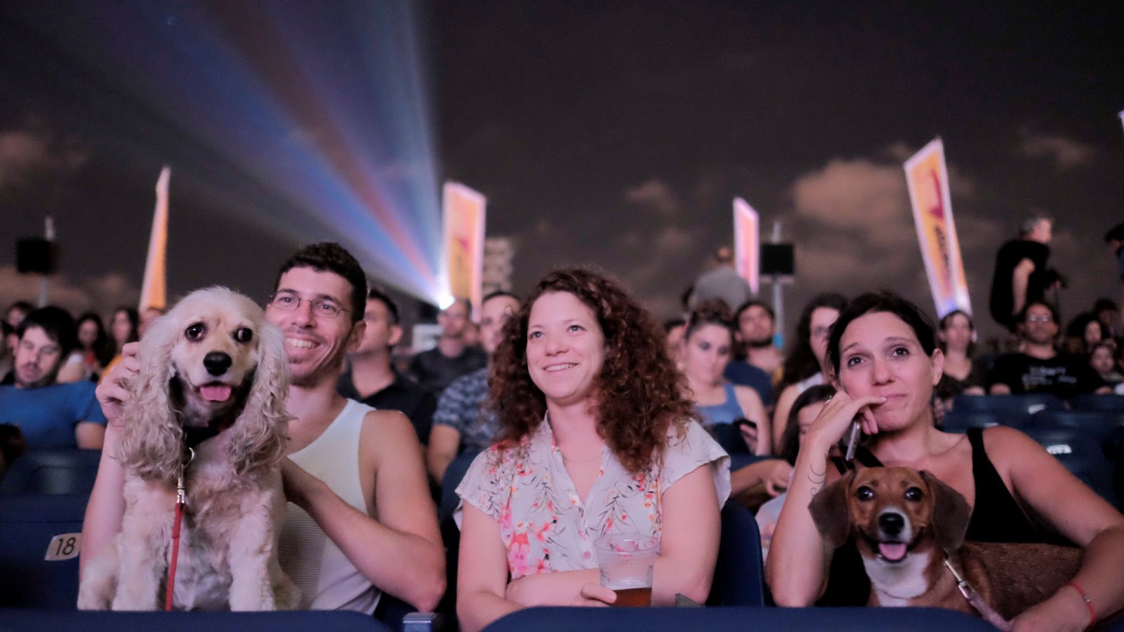 Israelis took their dogs to the movies on a rooftop at the Azrieli Center in Tel-Aviv on July 11, 2016. Photo by Tomer Neuberg/FLASH90