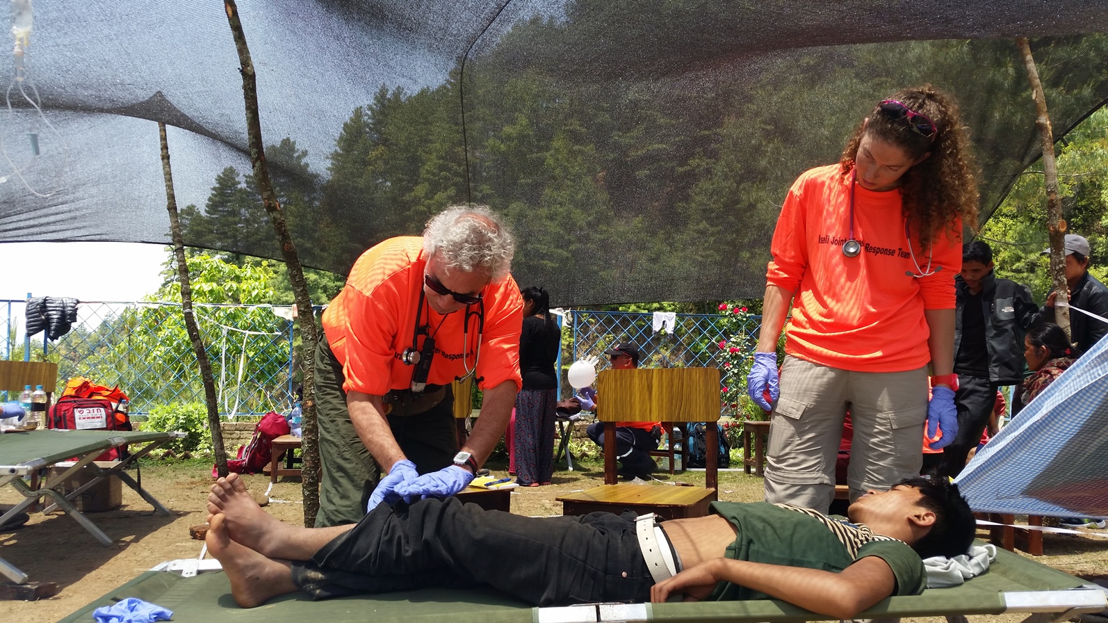 David “Dush” Barashi with a young patient, awaiting further surgery on an amputated foot. Photo courtesy of Dream Doctors Project