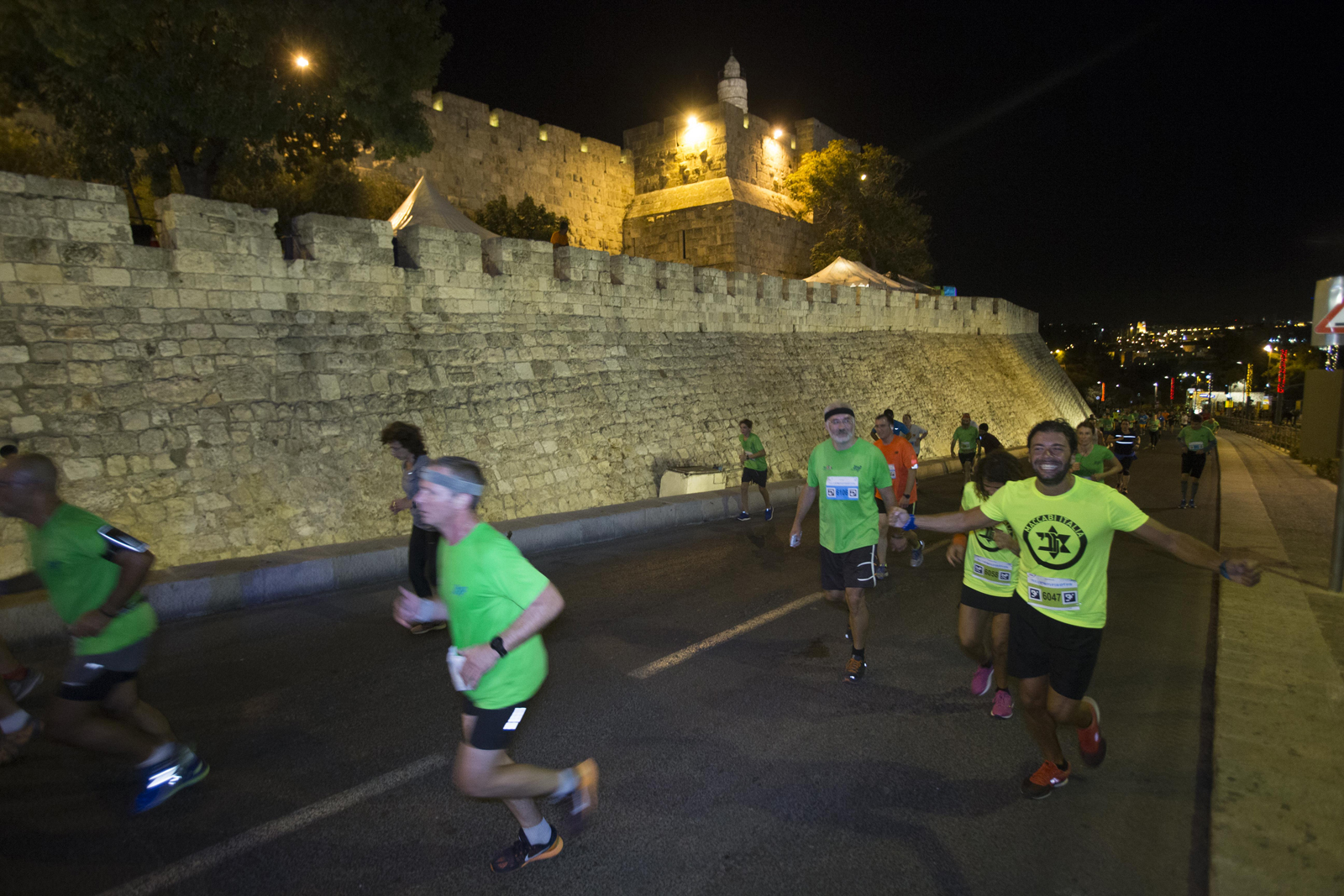 Running past landmarks in Jerusalem Maccabiah Night Run. Photo by Hadas Parush/Flash90   