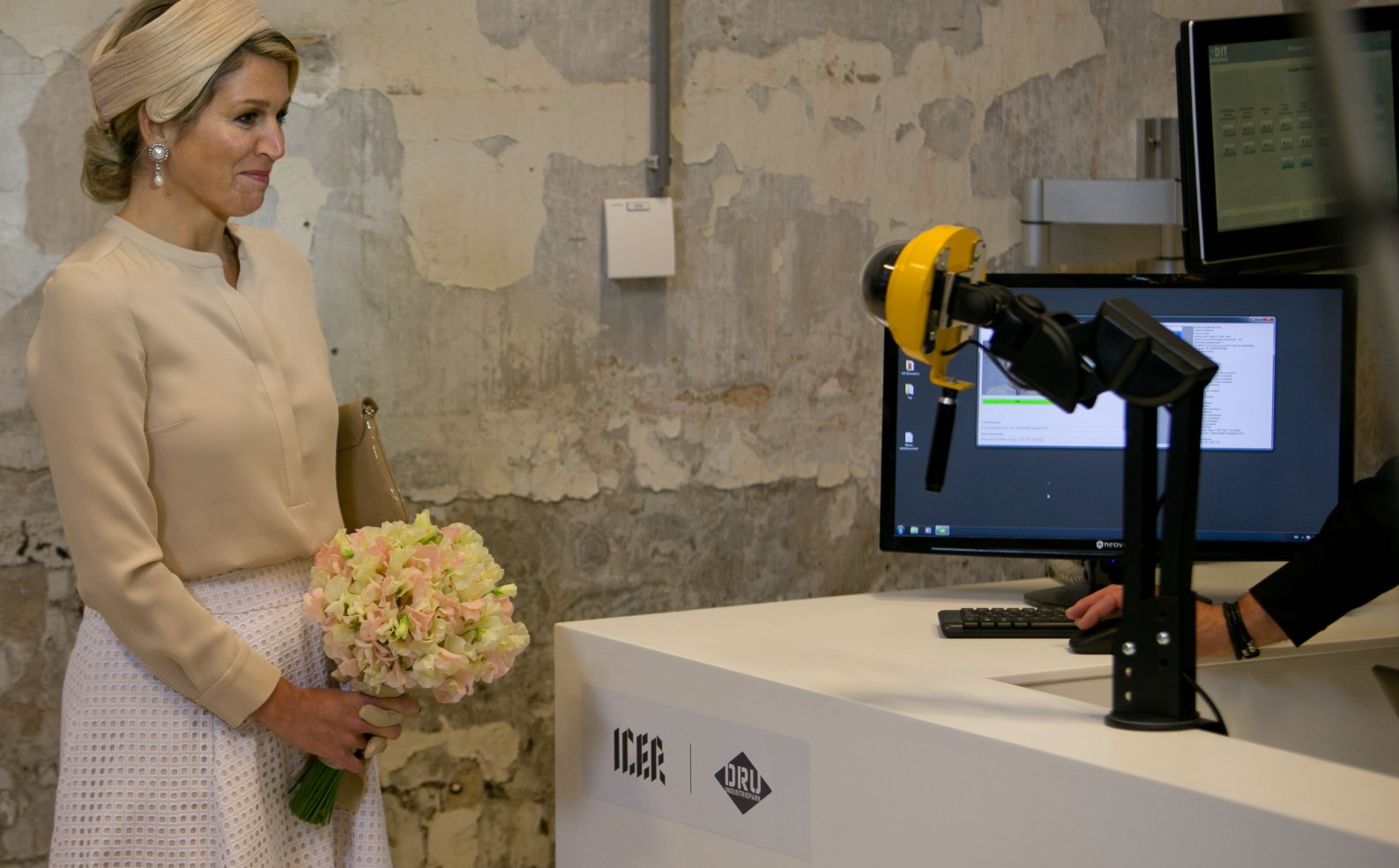 Queen Máxima of the Netherlands at a facial recognition station in the ICER Innovation Center in Holland, which employs FST’s In Motion Identification technology to give visitors personalized information about exhibits as they pass through interactive checkpoints. Photo courtesy of ICER.EU Queen Máxima of the Netherlands at a facial recognition station in the ICER Innovation Center in Holland, which employs FST’s In Motion Identification technology to give visitors personalized information about exhibits as they pass through interactive checkpoints. Photo courtesy of ICER.EU