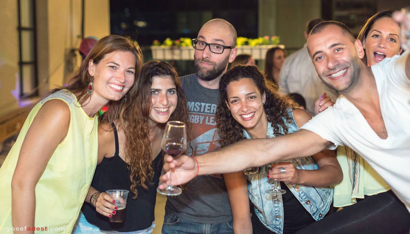 Wine Wednesday participants enjoying vino in Tel Aviv. Photo by Yosef Adest