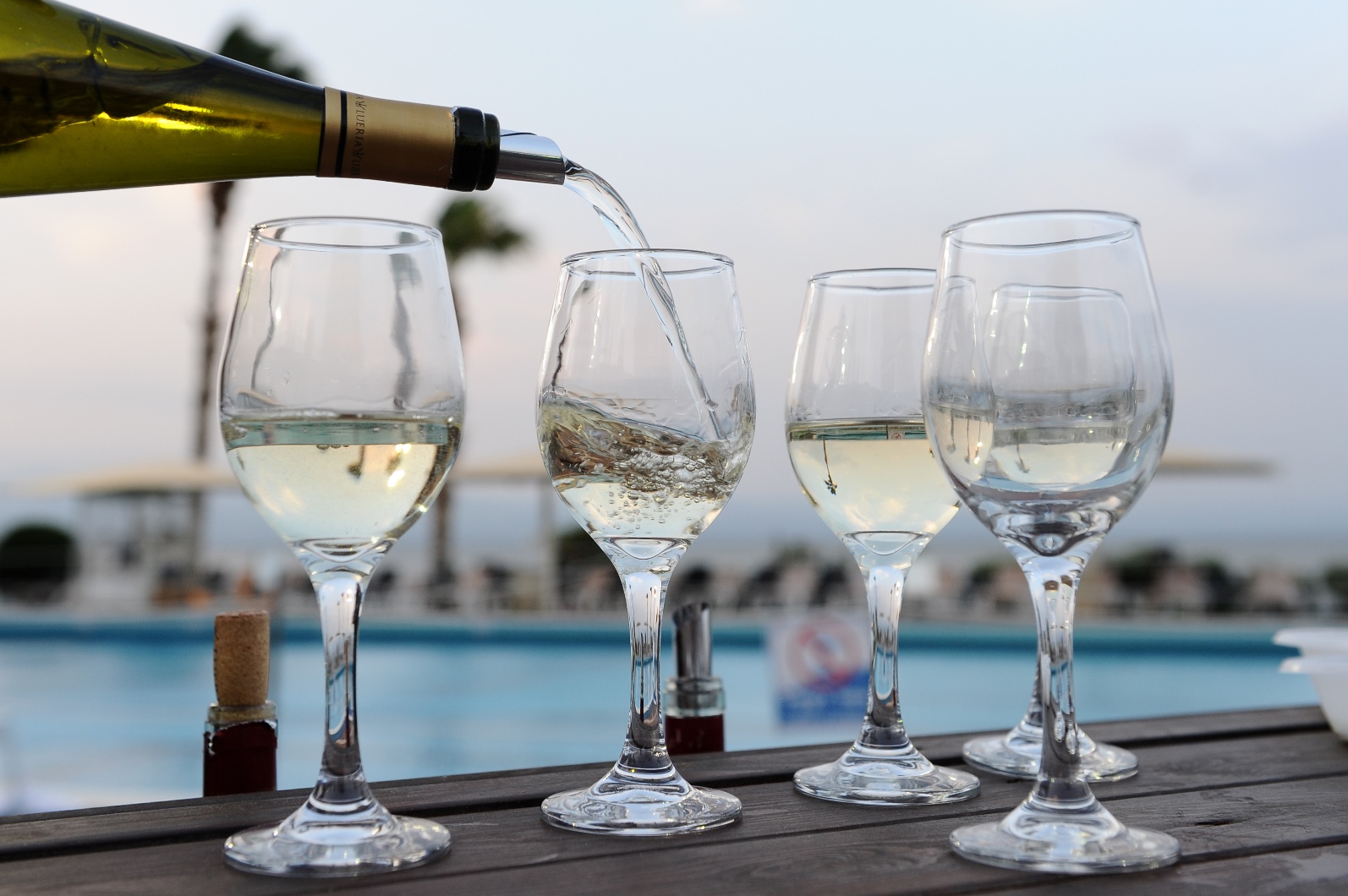 White wines being poured in the northern Israeli city of Tiberias. Photo by Mendy Hechtman/FLASH90