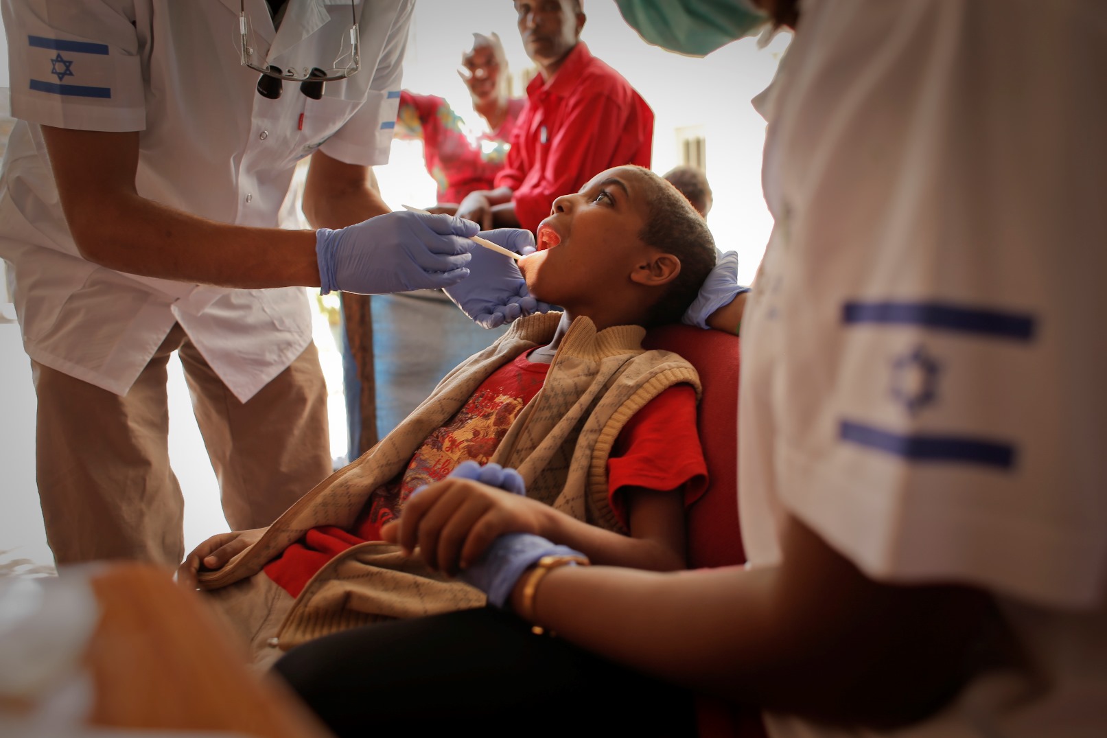 An Israeli dentist and post-army volunteer caring for a child in Ethiopia. Photo courtesy of FFL An Israeli dentist and post-army volunteer caring for a child in Ethiopia. Photo courtesy of FFL