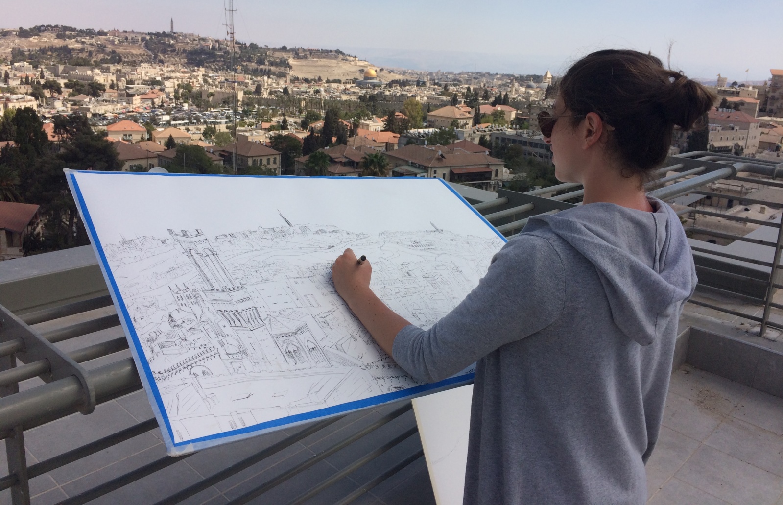 Lenore Cohen took up a position on the roof of Boutique Hanevi’im to draw her version of the skyline. Photo courtesy of Jerusalem Biennale Lenore Cohen took up a position on the roof of Boutique Hanevi’im to draw her version of the skyline. Photo courtesy of Jerusalem Biennale