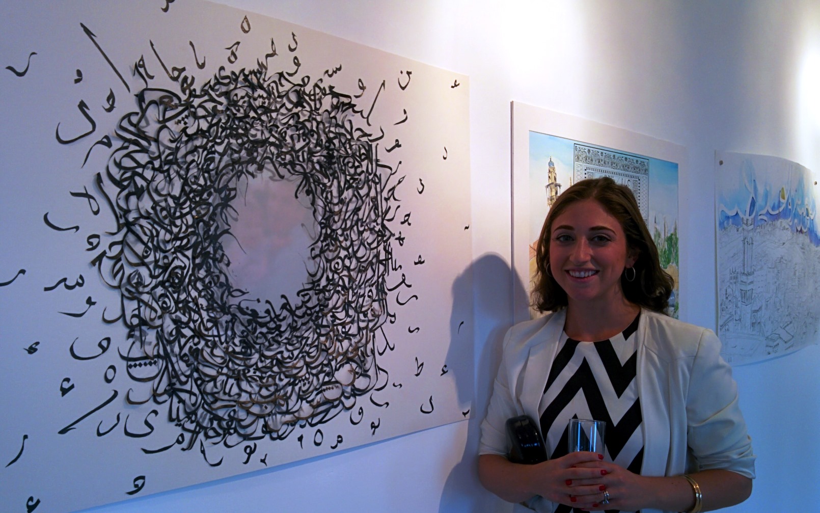 Lenore Cohen with a work in which she placed a muted photo of herself and her father in the center. Photo by Abigail Klein Leichman Lenore Cohen with a work in which she placed a muted photo of herself and her father in the center. Photo by Abigail Klein Leichman