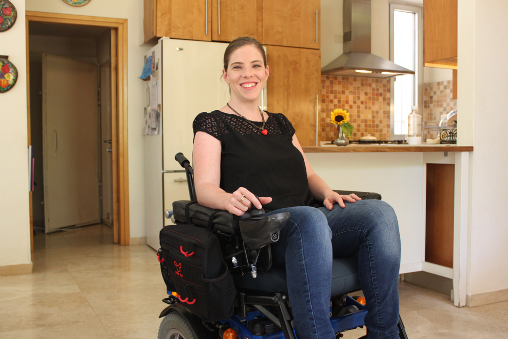 Handy Bag’s Side Bag model attaches to the side of an electric wheelchair for one-hand access. Photo: courtesy