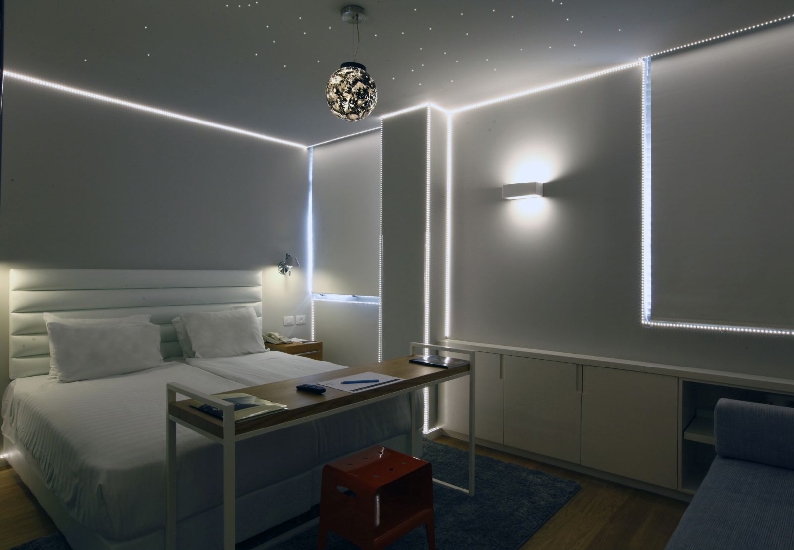 Ron Slavin’s works light up this Artplus Hotel room. Photo by Hai Avraham