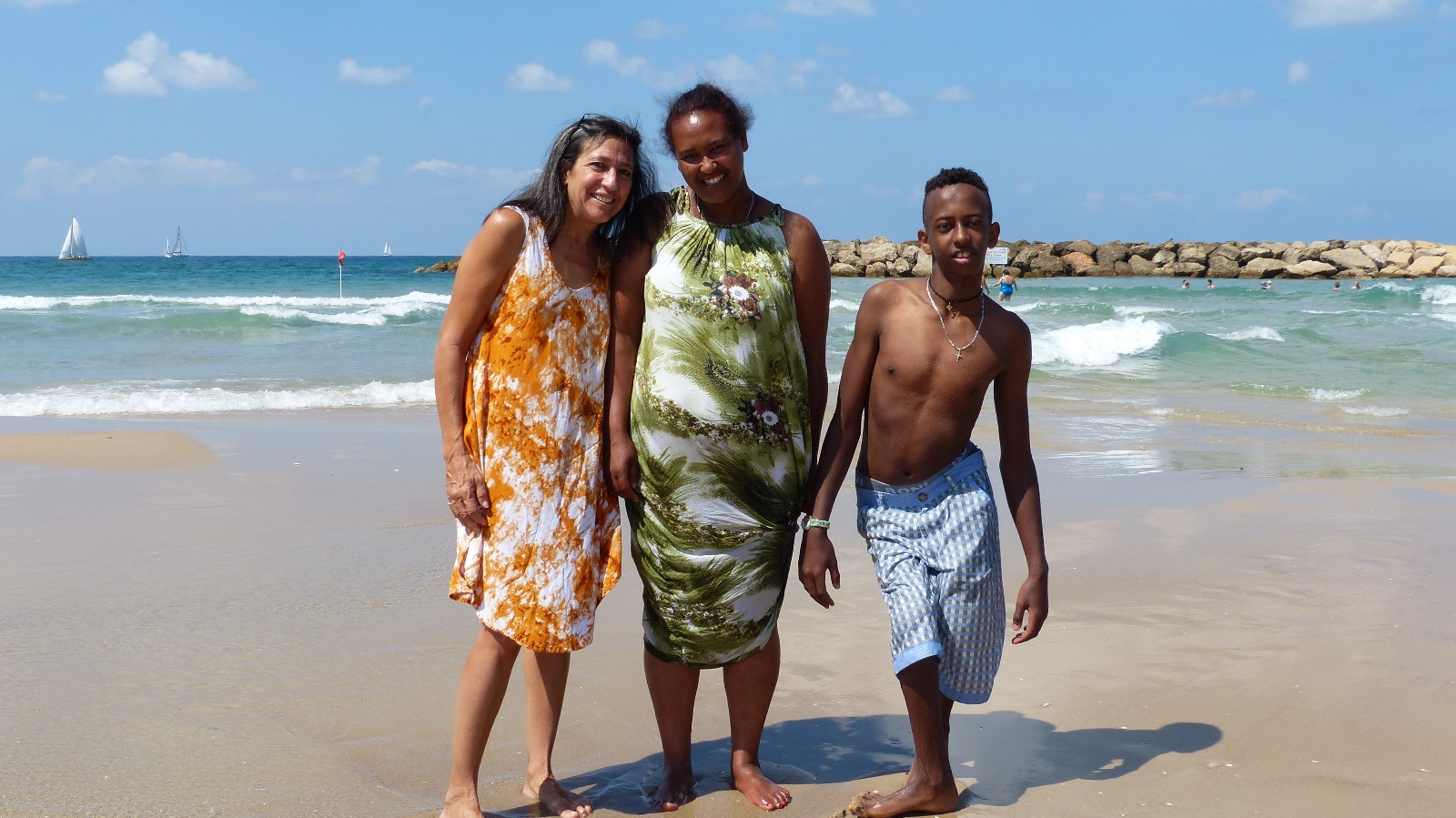 Lori Bacher with Nobel and his mother on the beach in Herzliya. Photo by Doron Bacher