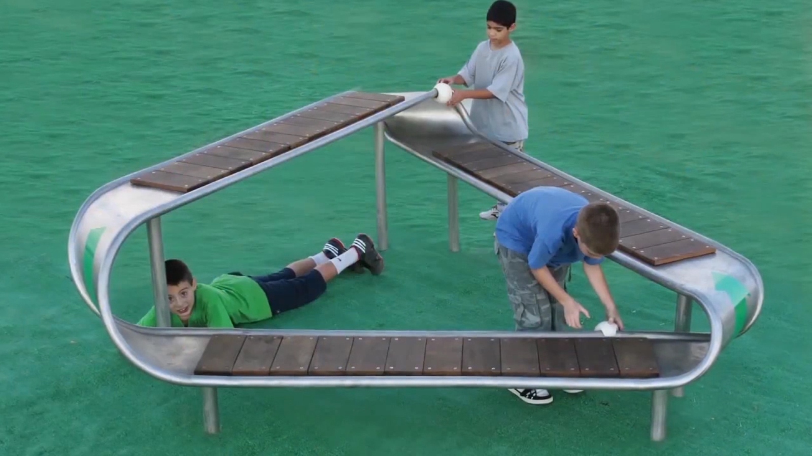 This Mobius bench in the shape of the international recycling logo has only one side and one boundary component. Children slide balls along the bench and observe that a ball starting on the outer side will complete the circle on the inner side. Photo courtesy of ABA Science Play This Mobius bench in the shape of the international recycling logo has only one side and one boundary component. Children slide balls along the bench and observe that a ball starting on the outer side will complete the circle on the inner side. Photo courtesy of ABA Science Play