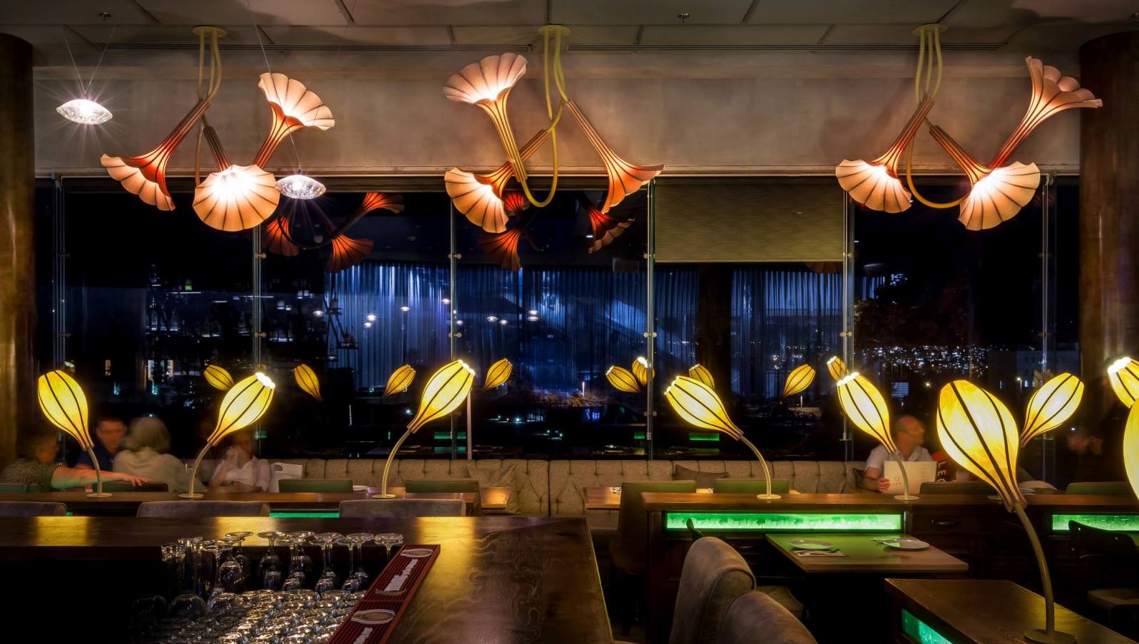 Studio Mabua lighting installed in a restaurant. Photography by Itai Aviran