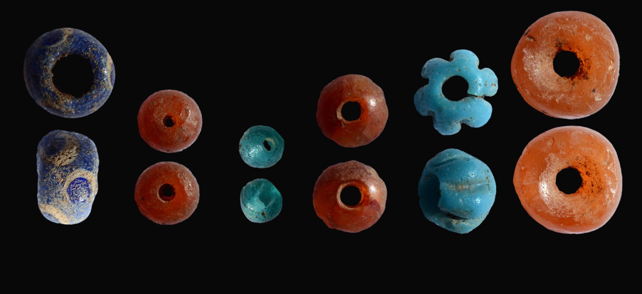 Colored beads were uncovered in the archaeological excavation inside the dolmen. Photo by Shmuel Magal, courtesy of the Israel Antiquities Authority