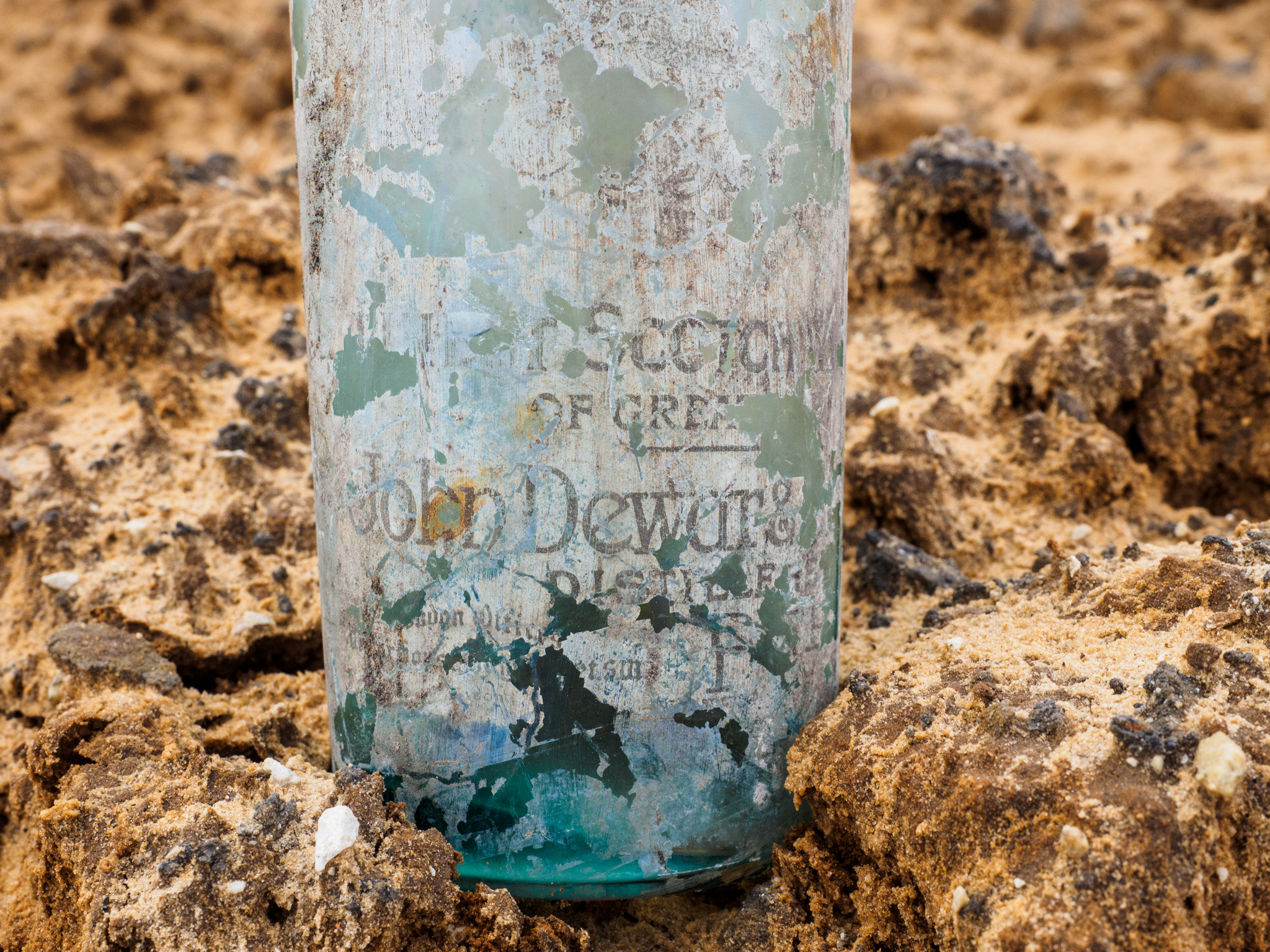 A Scotch whisky bottle with an old label. Photo by Assaf Peretz, courtesy of Israel Antiquities Authority