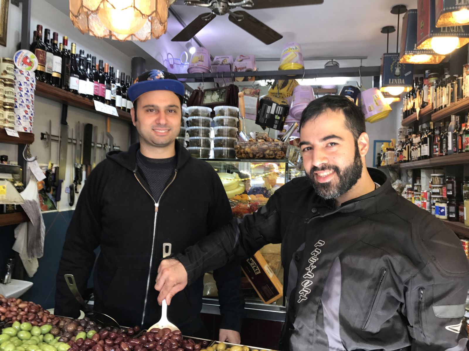 Yom (Yomi) Tov (left) working in the deli on Levinsky Street set up by his grandfather, with cousin Hen Morgenshtein. Photo by Nicky Blackburn