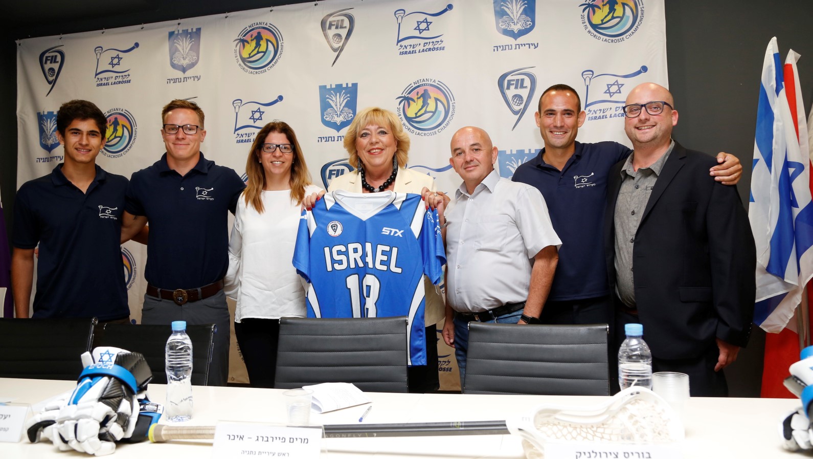 Netanya Mayor Miriam Feirberg-Ikar holding her honorary Team Israel lacrosse jersey. Photo: courtesy