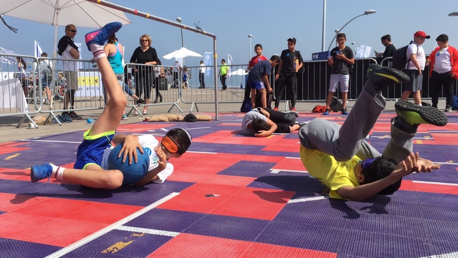 Kids try goalball at Accessibility Awareness Day in Tel Aviv. Photo by Keren Isaacson/Israel Paralympic Committee