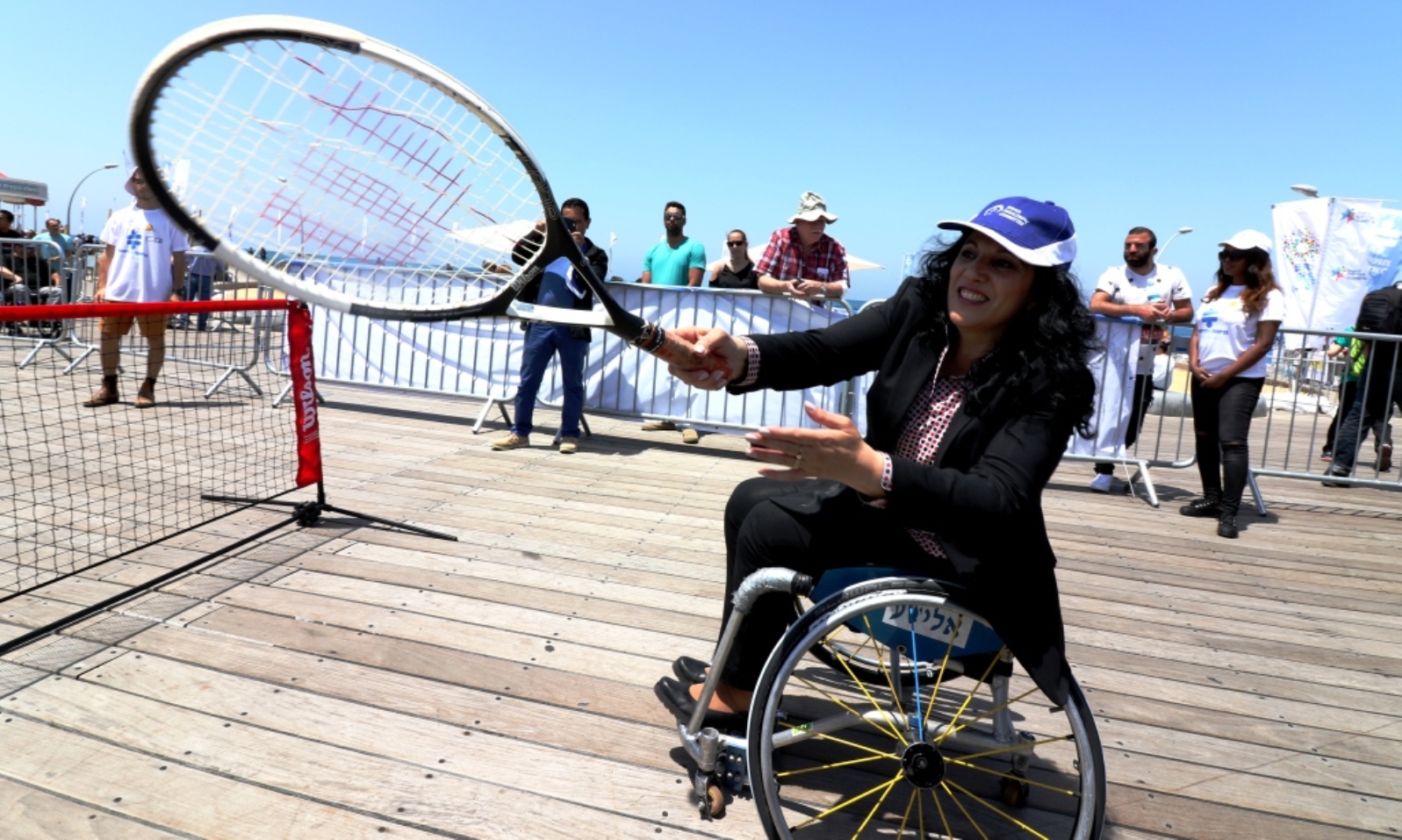Member of Knesset Nurit Koren playing wheelchair tennis at Accessibility Awareness Day in Tel Aviv. Photo by Keren Isaacson/Israel Paralympic Committee