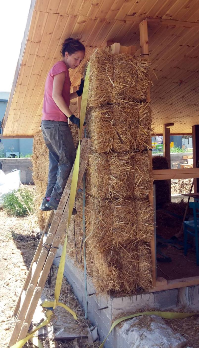 Dana Dweck-Sadeh working on her house made with straw-bale walls. Photo: courtesy