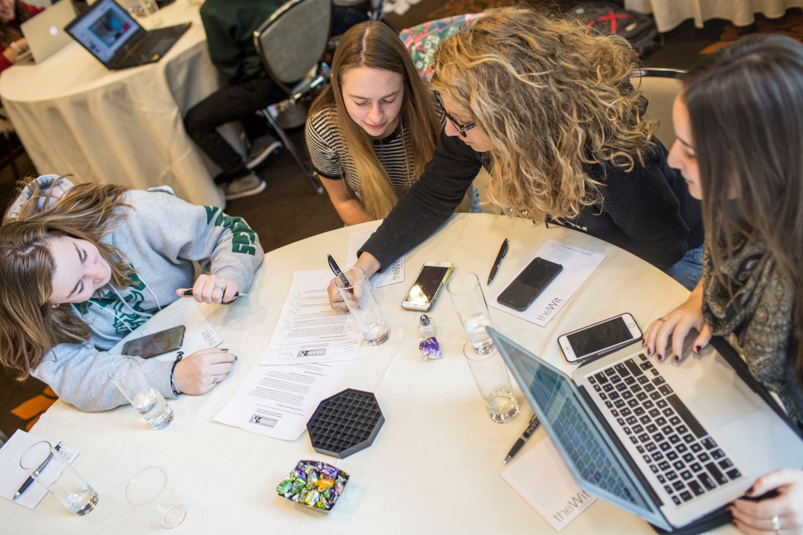Students put the last-minute touches to their presentation. Photo by Erica Barraca/Erica Barraca Photography