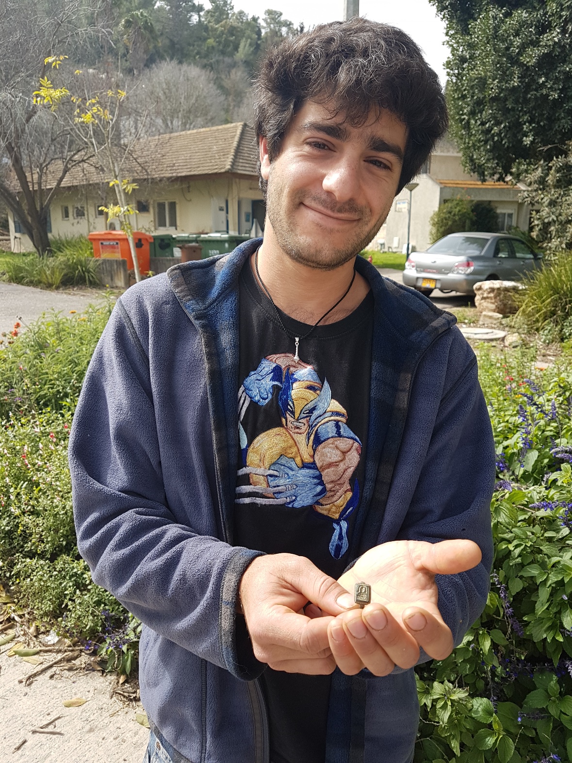 Gardener Dekel Ben-Shitrit with the St. Nicholas ring he found. Photo by Nir Distelfeld/Israel Antiquities Authority