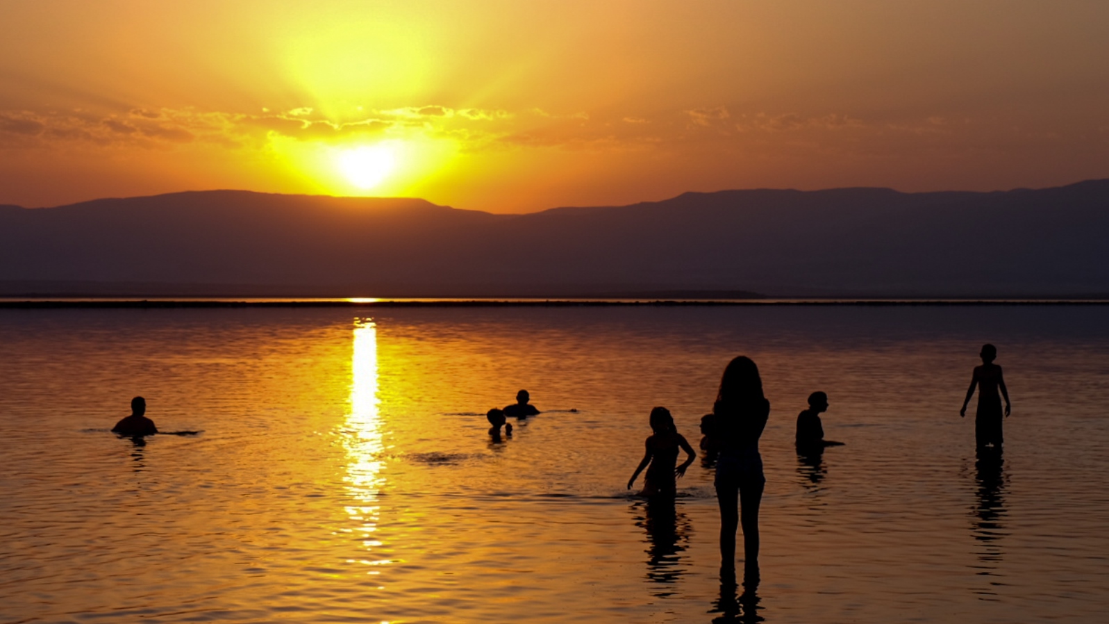 Bathers in the Dead Sea at sunrise. Photo by Gershon Elinson/FLASH90