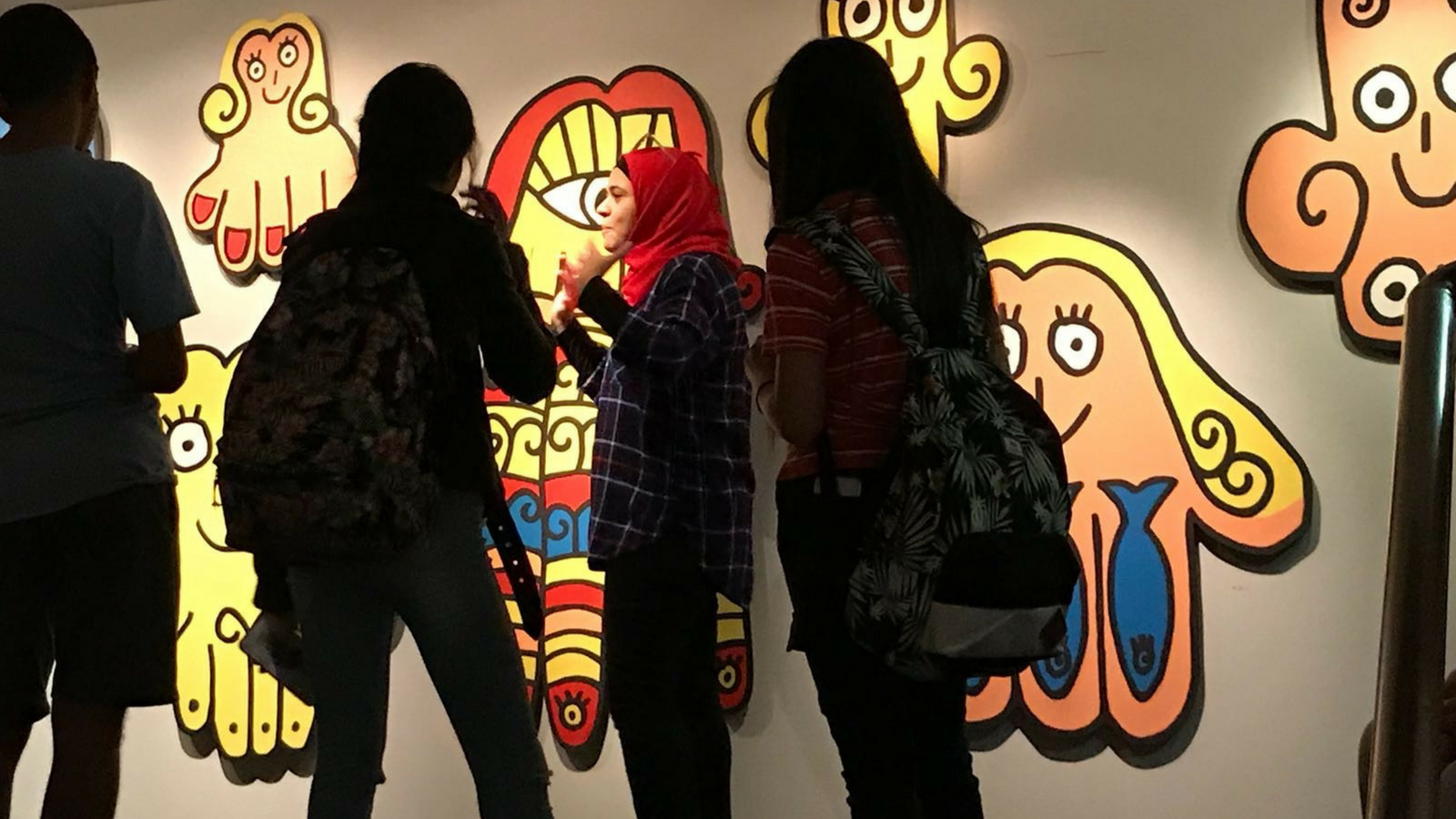 A tour guide leads a group through the “Khamsa, Khamsa, Khamsa” exhibition at the Museum for Islamic Art. Photo by Shirat-Miriam Shamir