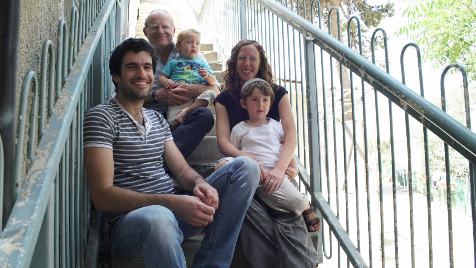 Four generations of the Simon family, all Kibbutz Beit Yisrael members, on the steps of their communal home in Jerusalem. Photo: courtesy