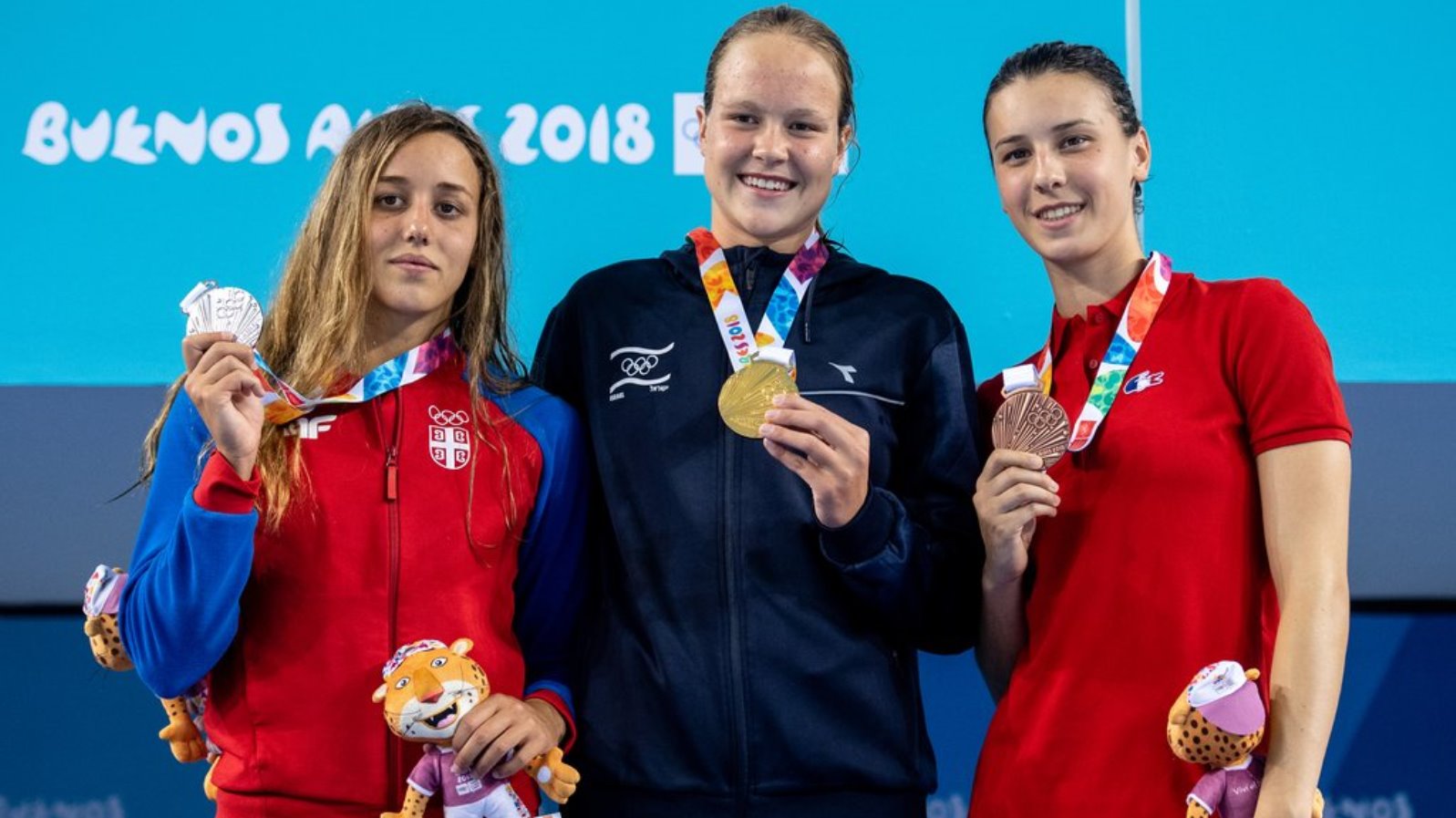 Anastasia Gorbenko, center, Israel’s gold medalist in the women’s 200-meter individual swim medley at the 2018 Youth Olympic Games in Argentina. Photo: @iocmedia