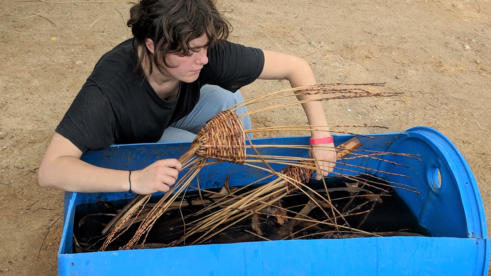 An industrial design student soaks date branches used to create baskets at Bezalel Academy’s annual Dead Sea Seminar in December 2018. Photo: courtesy