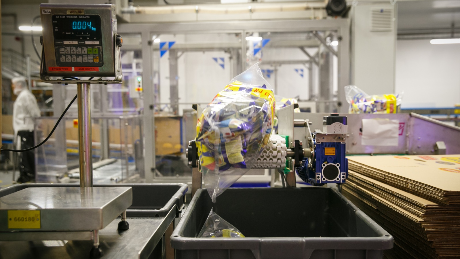 Bamba on the assembly line at the new factory in Kiryat Gat, February 2019. Photo by FLASH90