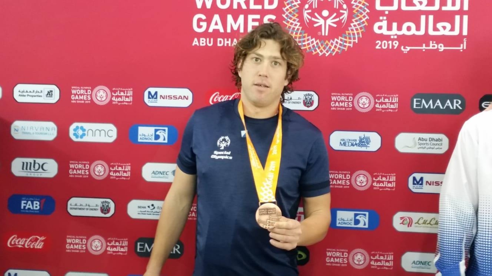 Israeli Special Olympics swimmer Daniel Ben Assa wearing his gold medal from the 2019 World Games in Abu Dhabi. Photo via Facebook