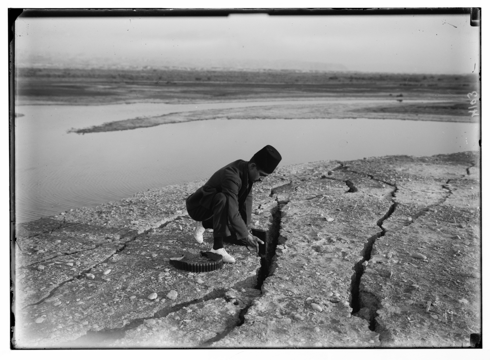 At the Dead Sea, a guard accompanying the American Colony photographers inserts his rifle into a fissure caused by the 1927 earthquake. Photo from the Matson (G. Eric and Edith) Photograph Collection/US Library of Congress