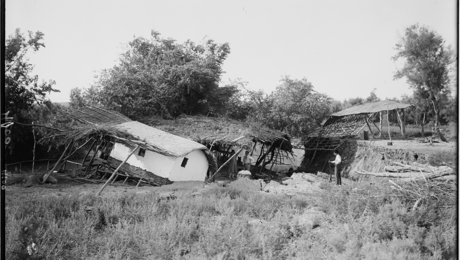 American Colony photographers took this picture of a traditional reed house that, following the 1927 earthquake, was caught in a landslide and left hanging on the banks of the Jordan River. Photo from the Matson (G. Eric and Edith) Photograph Collection/US Library of Congress