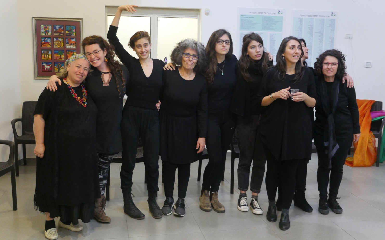 Arab-Jewish playback theater group The Heart of our Stories at Tel Hai College, with facilitator Efrat Ashiri, left, and leader Lamis Dakwar, second from right holding cup. Photo courtesy of Together Beyond Words