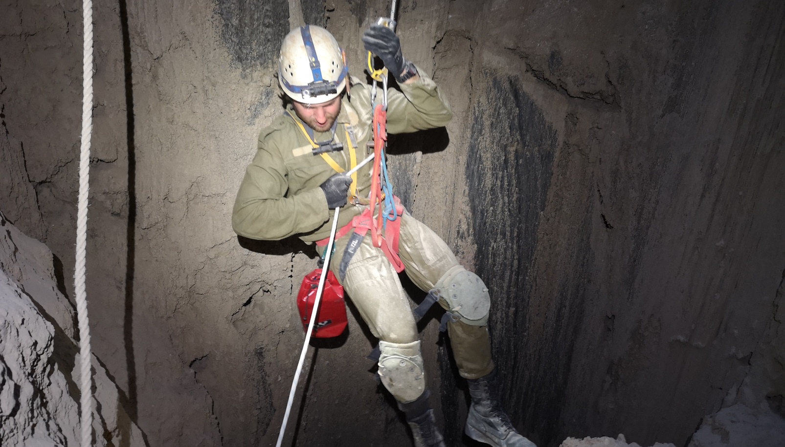 A caver descending into the Malham salt cave in Mount Sodom. Photo by Yoav Negev