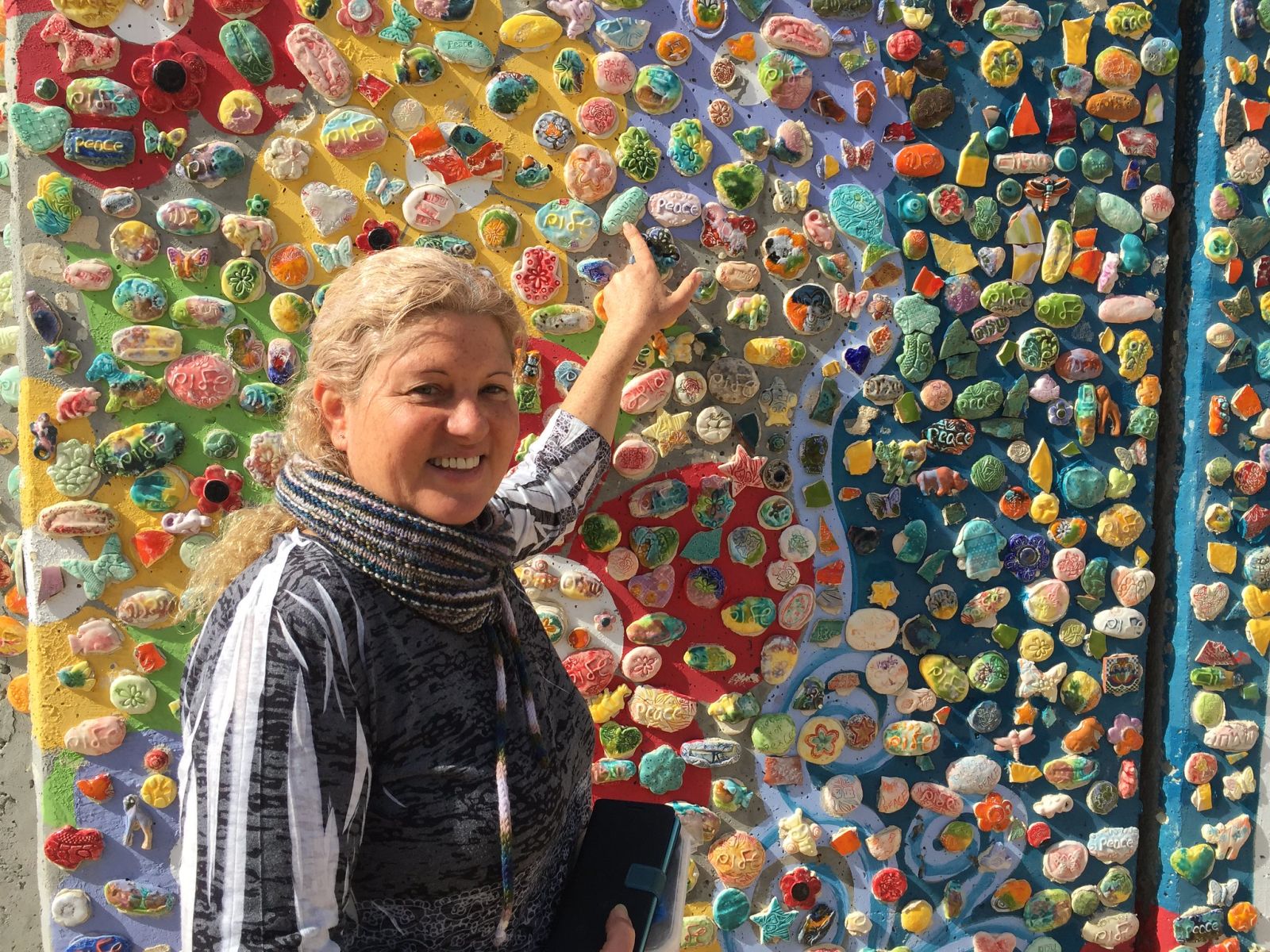 Tsamaret Zamir channels her energies into the beautiful Peace Wall Mosaic. Photo by Nicky Blackburn