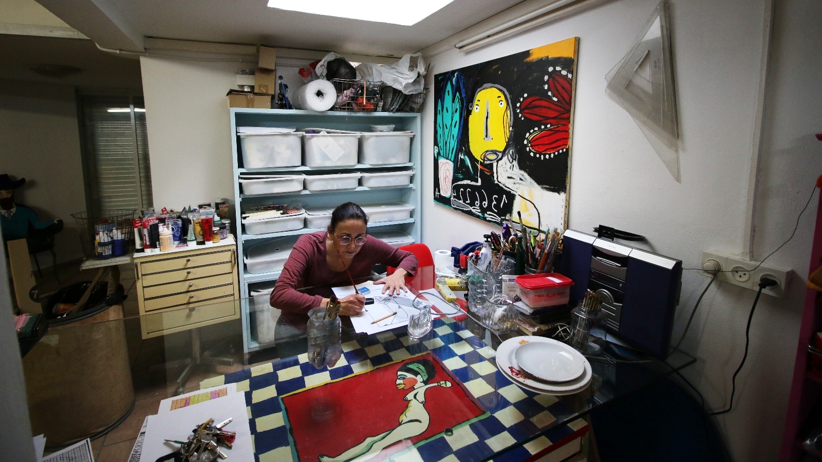 Tamar Messer at work in her gallery. Photo by Hagar Messer