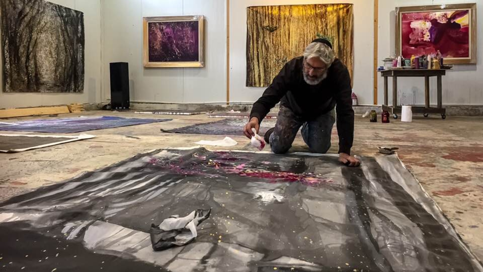 Biblical painter Yoram Raanan at work in his rebuilt studio. Photo: courtesy