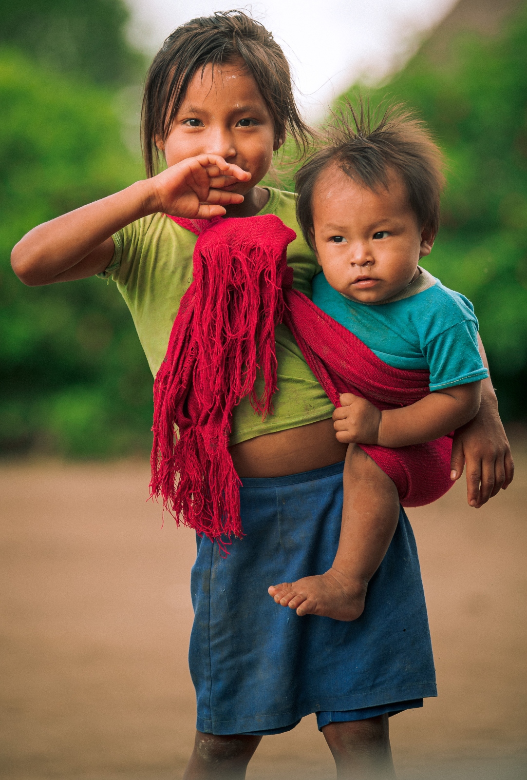 A girl carrying her little brother in Sharamenza, Ecuador. Photo courtesy of MyHeritage