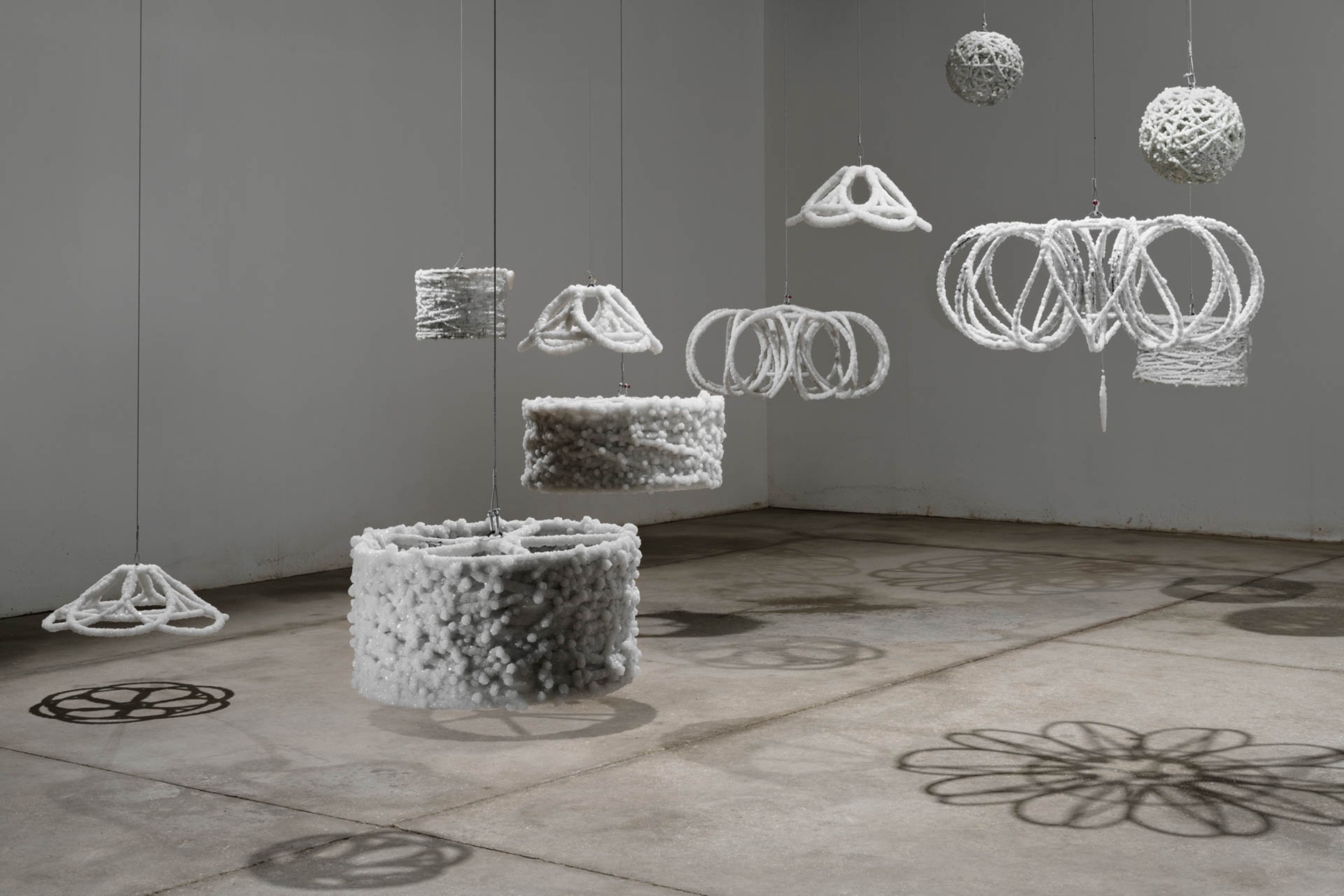 “Strand, 2017” -- Barbed-wire lampshades and coils coated in salt crystals,studio installation views. Photo by Yotam From, ©Sigalit Landau, 2019