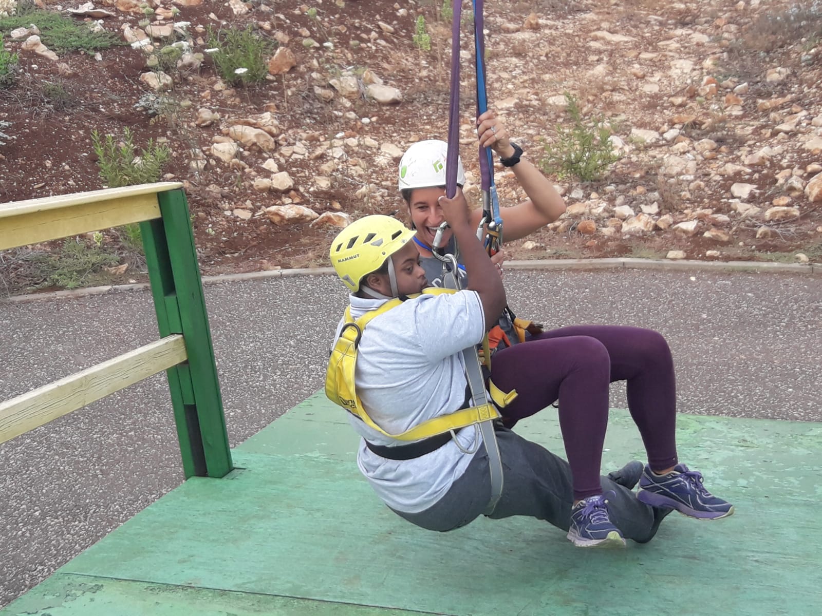 My Piece of the Puzzle counselor Talia accompanied camper Roni on the zipline as other campers cheered him on. Photo: courtesy
