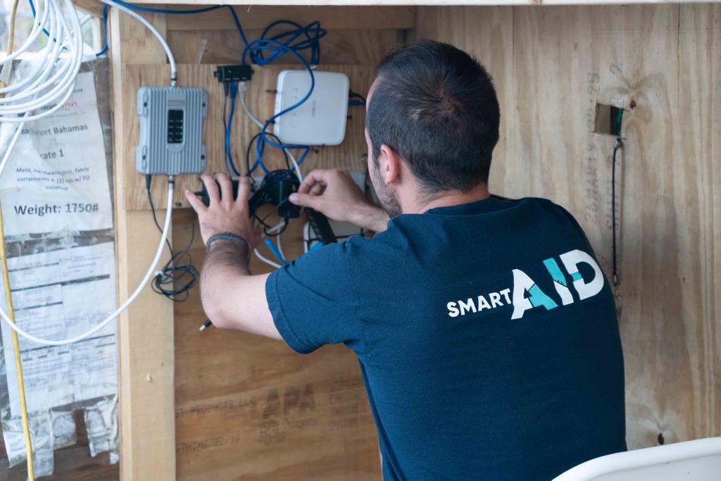 A SmartAID volunteer building a communications center in the Bahamas. Photo: courtesy