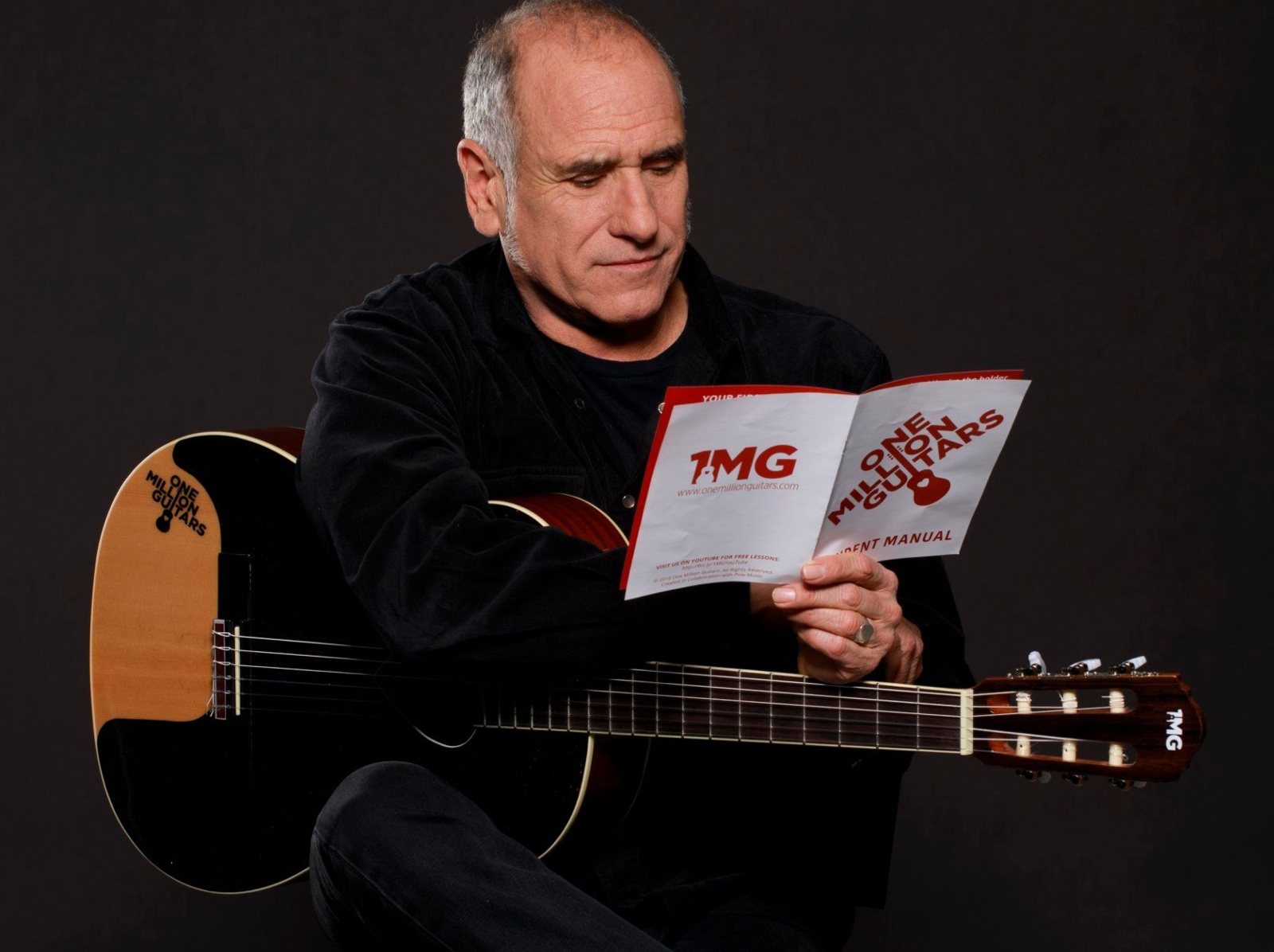 David Broza with a One Million Guitars instrument. Photo by Ilan Besor