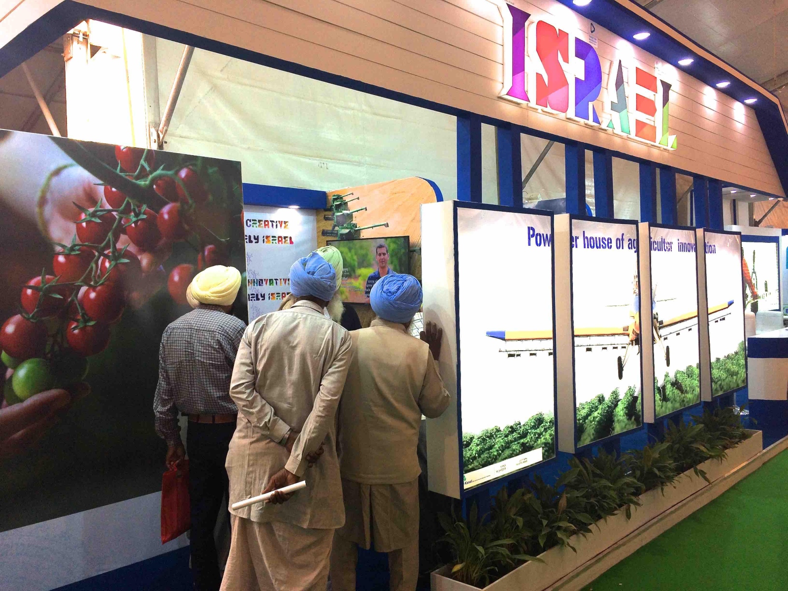 Indian farmers exploring Israeli technology at a trade show. Photo by Dr. Ram Fishman