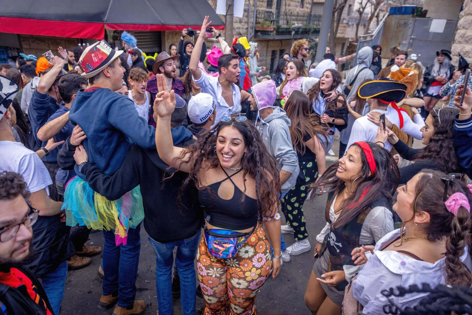 People dressed up in costumes party at the Nachlaot neighborhood of Jerusalem during the Jewish holiday of Purim, on March 8, 2023. Photo by Erik Marmor/Flash90