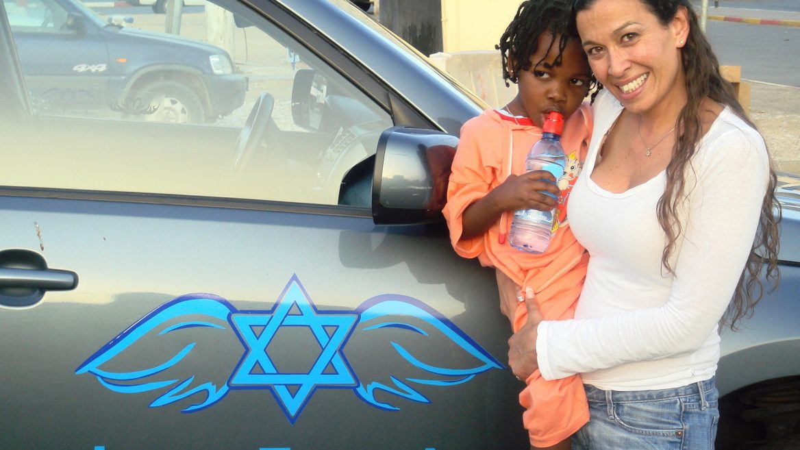 Gal Lusky assisting a Sudanese orphan in Egypt.