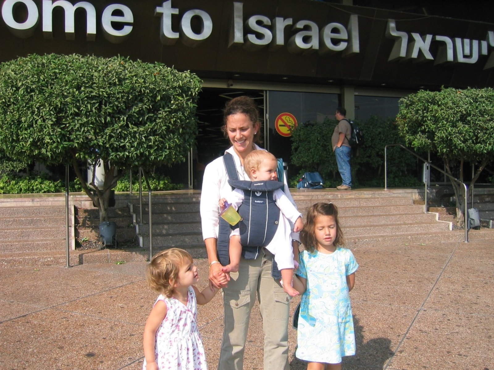 Isa Zweiback and her sisters as little girls landing in Israel with their parents.