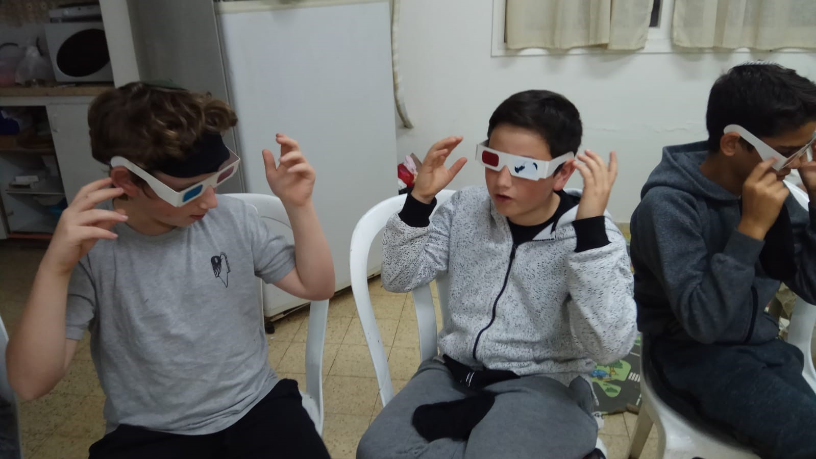 Children in a Seeing Differently workshop experience different kinds of vision impairment. Photo courtesy of Ofek Liyladenu