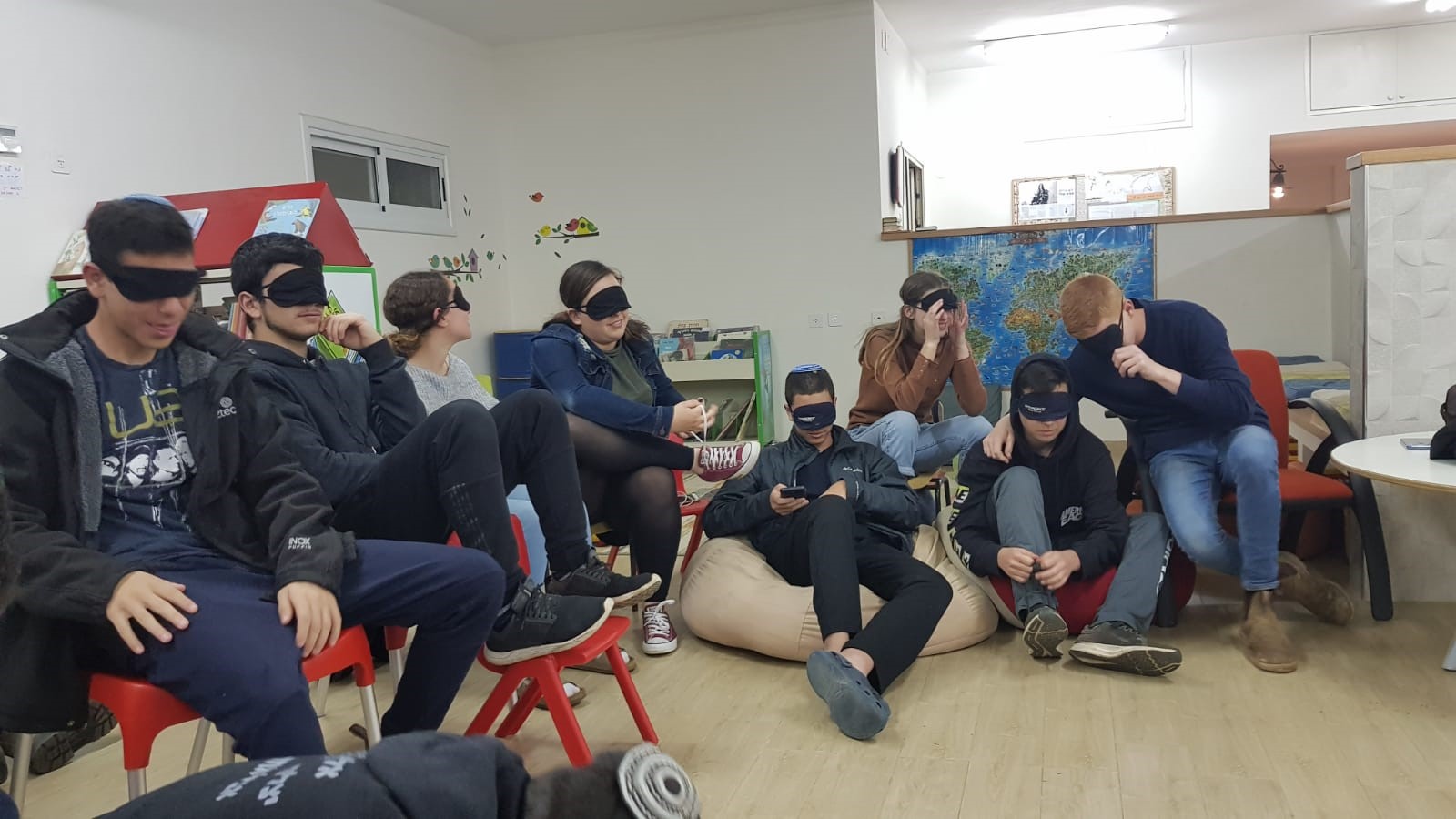 Teens in a community center experiencing a Seeing Differently workshop. Photo courtesy of Ofek Liyladenu
