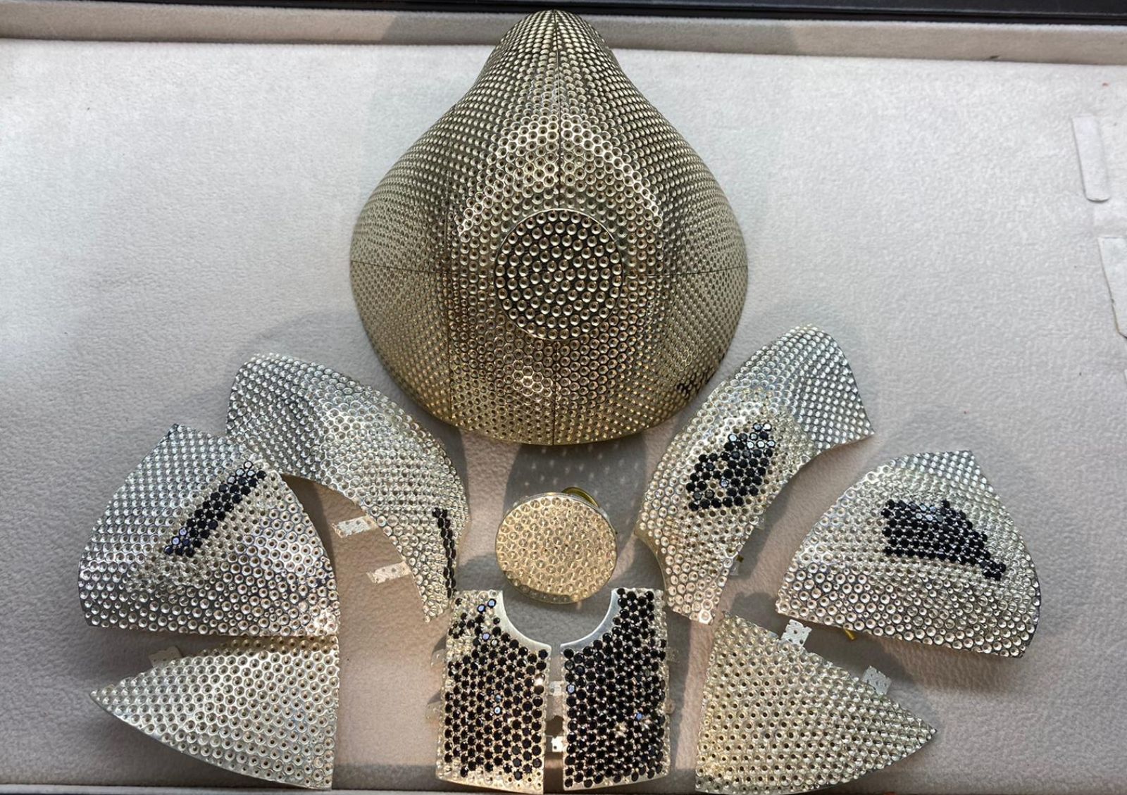The facemask is being put into place and studded with more 3,000 diamonds. Photo courtesy of Yvel Studio